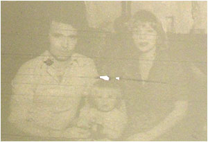 Caption: At home in their cottage at Two Gates – Dave and his wife Pauline with two-year-old daughter Kelli.