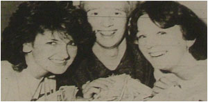 Caption: Pam Paton (left) with Andrew Brown and Dena Adams count up the generosity as the spectacular concert gets underway.